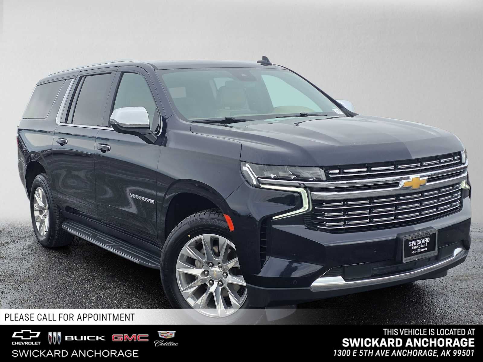 2024 Chevrolet Suburban Premier in Midnight Blue Metallic — front three-quarter view
