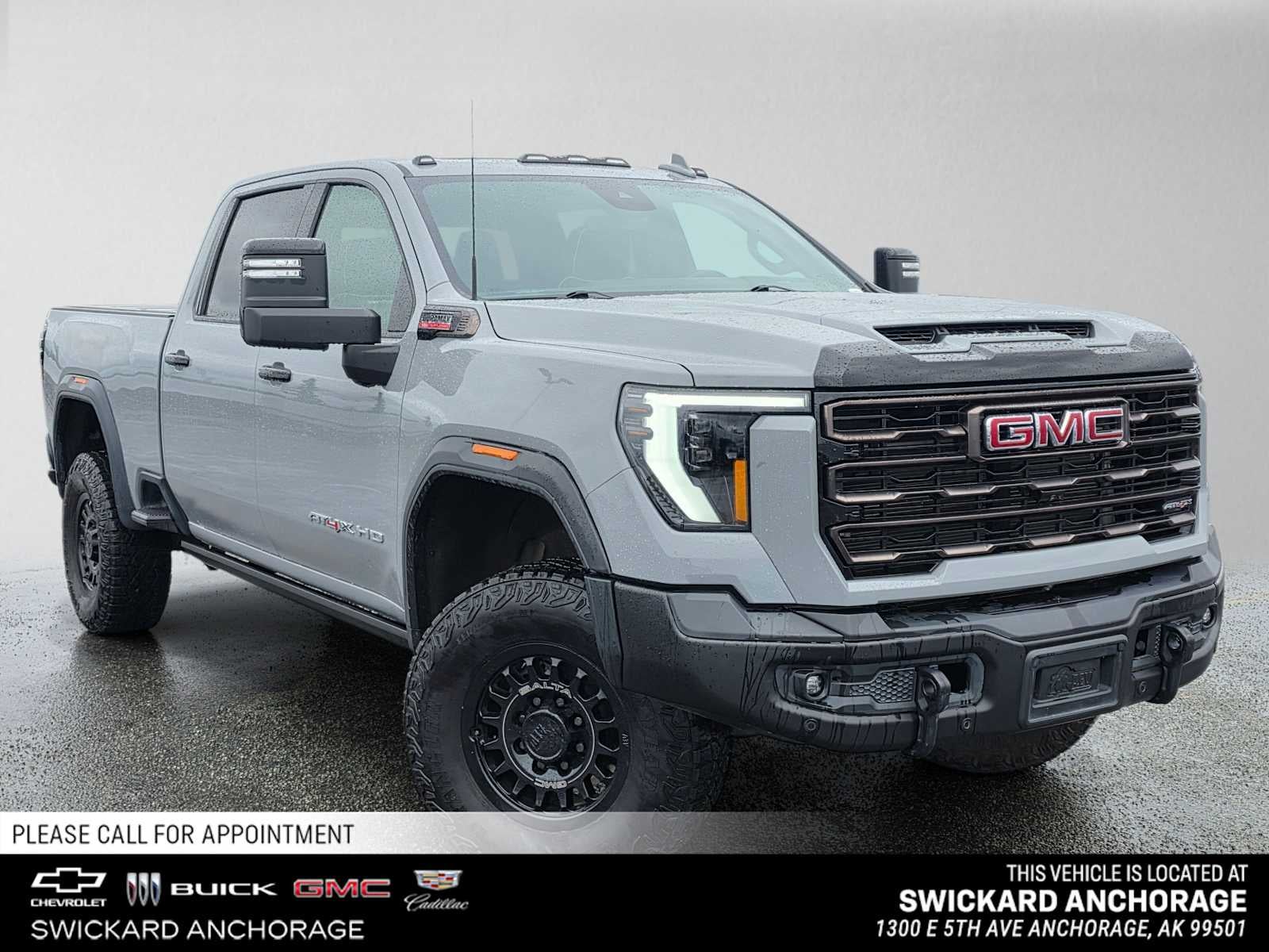 2024 GMC Sierra 2500 HD AT4X in Thunderstorm Gray — front three-quarter view