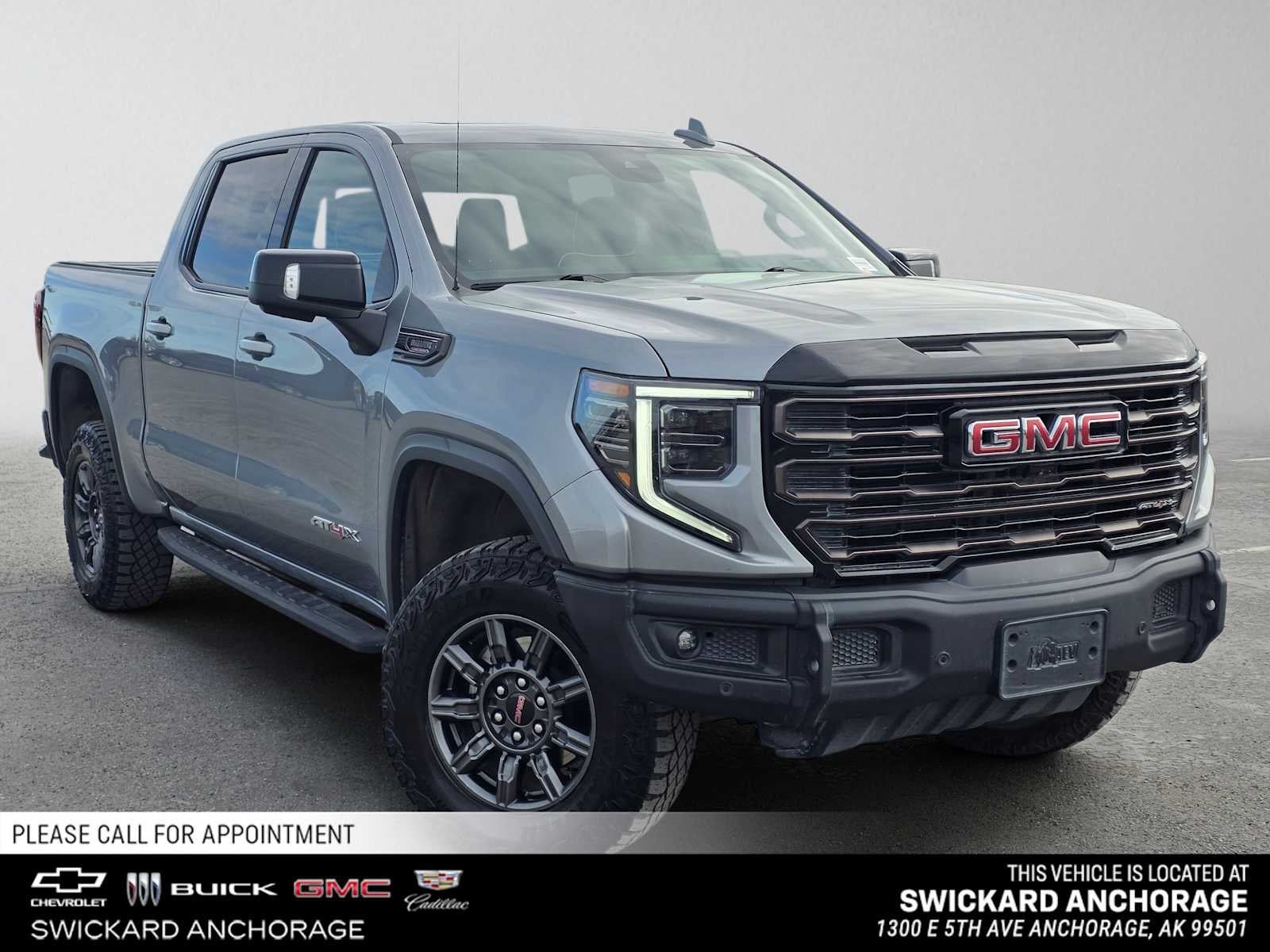 2024 GMC Sierra 1500 AT4X in Sterling Metallic — front three-quarter view